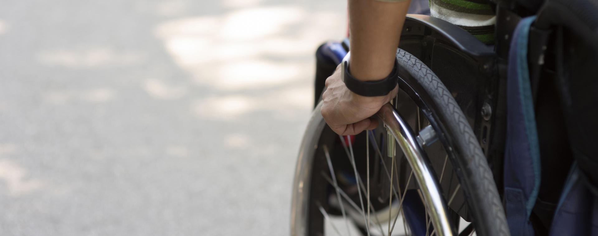 A person in wheelchair. Photo by FreePik.com